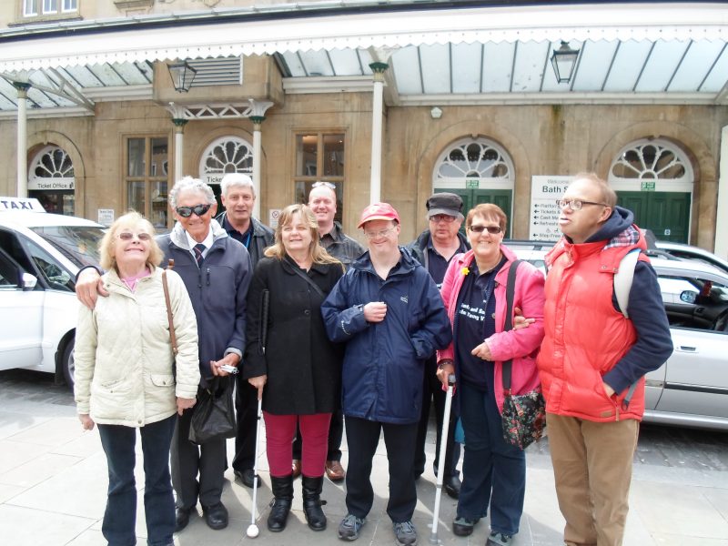 Sylvia, Harry, Spud, Julie, Paul, Andrew, Ernest, Kym &amp; James outside Bath Spa railway station